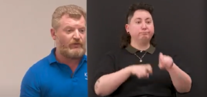 Screenshot of Dmitry Levin on left and interpreter on right